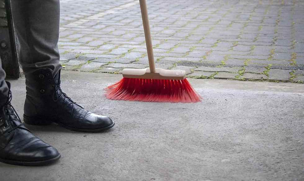 Dust and clean garage door track image